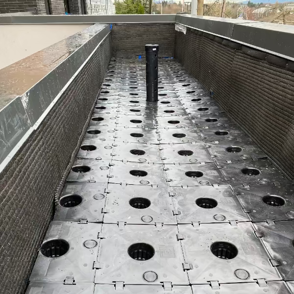 GardenWells sub-irrigation installed in a concrete or masonry planting area